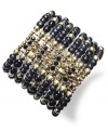 Slip on vintage appeal with this luxe bracelet from Style&co. Black and gold glass and metal beads create timeless appeal. Stretches to fit wrist. Crafted in antiqued gold tone mixed metal. Approximate length: 7-1/2 inches.