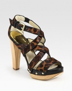 Natural wooden heel topped with small studs and leather trim, this leopard-print calf hair design exudes animal magnetism. Wooden heel, 4½ (115mm)Island platform, 1 (25mm)Compares to a 3½ heel (90mm)Leopard-print calf hair and leather upperLeather lining and solePadded insoleImported