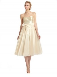 Tonal sequins shine on the bodice of this exceptionally chic tea length style with a delicate sash cinching the waist.Spaghetti straps Tonal sequined bodice Interior bra cups Tie-sash waist Back zipper Pleated organza skirt Fully lined About 47 from shoulder to hem Polyester Spot clean Imported