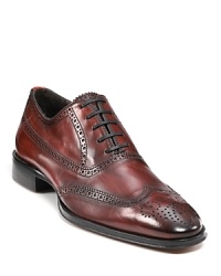 Rendered in rich burgundy leather, these polished To Boot New York lace-up shoes tout chic wing tip details, for a smart nod to timeless style.