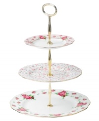 Revive a classic dinnerware pattern with the Vintage tiered cake plate. Lush blossoms plucked from Royal Doulton's Old Country Roses collection flower on white bone china with ruffled gold edges.