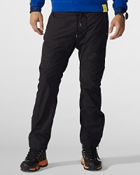 RLX's sporty Mountain Rappel Pant is crafted from a lightweight cotton poplin blend with rugged utilitarian detailing and an adjustable drawstring waist for a custom fit.