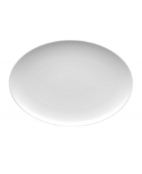 With subtle concentric rings and a sleek shape in durable porcelain, Rosenthal's Loft oval platter brings chic versatility to modern tables.