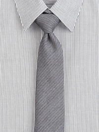 Solid silk blend tie with subtle textured stripe pattern.About 2½ wide36% viscose/29% silk/21% wool/14% mohairDry cleanMade in USA of Italian fabric