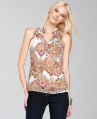 A flounce at the neckline lends INC's exotic-print top extra feminine flair.