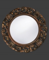 Open clamshells mingle with curling leaves in a mottled bronze ring with inner beading. Alluring on the bedroom, living room or foyer wall, this round mirror dresses up any space with timeless, lasting beauty.