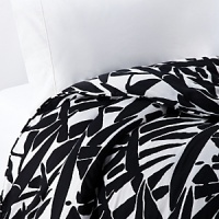 Keep it simple...or dress it up with color. This collection is white on black in a bold print. Leaves of giant grass grace this soft cotton duvet, complementing any modern bedroom.