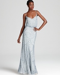 Intricate beading takes form in a scalloped pattern on Adrianna Papell's standout blouson gown.