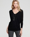 Fall's scoop-worthy Vince sweater with a classic V-neck silhouette, rendered in a soft wool blend.