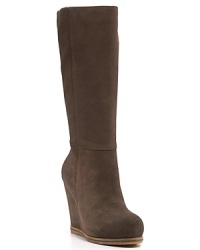 Basic yet bold, these sculpted wedge boots move from the office to after hours in luxuriously soft suede. By Lucky Brand.