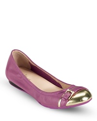 Dressy yet well-suited to everyday wear, these Cole Haan ballet flats feature brililant metallic cap toes with buckle details that add just the right amount of polish to a soft suede backdrop.