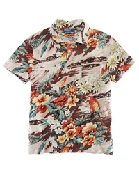 A preppy island print lends bold tropical appeal to a classic-fitting short-sleeved polo shirt in fluid cotton jersey.