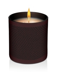 Set the holiday mood with Laura Mercier's limited-edition Signature Candles. In 7.5 oz. chocolate brown glass tumblers, each candle features Laura's signature style with a tone-on-tone snakeskin inspired deco. Laura Mercier Fresh Fig Signature Candle warms and delights with the sweet, intoxicating scent of gourmand ingredients, including the indulgent essence of fresh celeste figs blended with dewy fruit bouquets of apricot nectar and sensuous ylang ylang. The blend creates a rich, luxurious scent unlike any other. This delectable scent creates a wonderfully fragrant ambience that will warm your home for the holidays.Burn time: 55 hours.