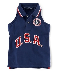 A red, white and blue design finished with U.S.A. patching and embroidered emblems gives a preppy all-American look to the classic sleeveless polo, celebrating Team USA's participation in the 2012 Olympics.