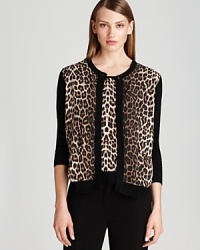 Exotics go executive as crisp leopard print enlivens a Bloomingdale's exclusive Gerard Darel twin set. Tame the statement look with a sleek pencil skirt and take your 9-to-5 style to fierce new heights.