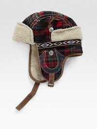 A winter essential, this trapper hat is crafted in a bold check pattern with signature horseshoe detail and trimmed with plush faux fur for long-lasting warmth.50% wool/50% polyesterDry cleanImported