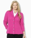 A soft knit cardigan is crafted with a heritage shawl collar and elegant peplum hem for feminine style.