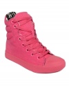 Bright neon colors take your kicks to the next level. Betsey Johnson's Nexuss high-top sneakers feature a fabric lining and a rubber sole.