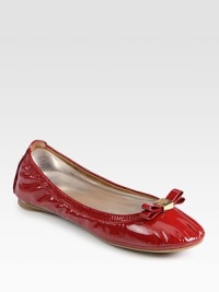 High-gloss patent leather flat has a stretchy upper and logoed bow adornment. Patent leather upperLeather liningRubber solePadded insoleImportedOUR FIT MODEL RECOMMENDS ordering true size. 