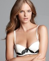 Contrast lace detailing gives a luxe lift to Pleasure State's fanciful balconette bra. Style #P23-2197W.