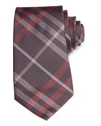 Crafted in soft silk, this signature check Burberry tie adds modern polish to your distinguished attire. A fetching addition to your lavish collection.