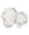 Well-crafted blooms create the illusion of texture on the sleek white porcelain of Oleg Cassini's Kavita place setting. Colorful variations from dish to dish and meticulous detail will make conversation flourish.