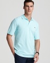 A classic pique polo features signature whale embroidery. From Vineyard Vines.