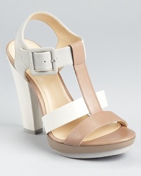 In a pale, chalky palette, these Calvin Klein sandals mix smooth leather, glossy patent, and soft suede.