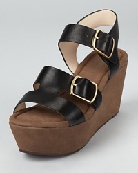 A chunky platform wedge in soft suede gives way to smooth leather straps on these statement-making Rosegold sandals.