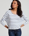 Fresh blue stripes on a dolman-sleeved BCBGMAXAZRIA top kick your style into high gear--the perfect pairing to your favorite rolled jeans when you're headed to the beach for a clam bake.