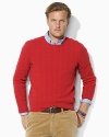 A refined crewneck sweater is knit from sumptuously soft cashmere for a handsome, preppy look.