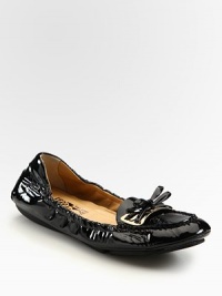 Stretchy patent leather with a dainty bow embellishment. Patent leather upperLeather lining and solePadded insoleMade in Italy