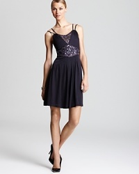 A beaded neckline and waist lend a sparkling sheen to this A line SW Studio by Sue Wong dress.