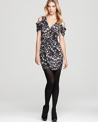 A printed Akiko dress gets flirty with cutout shoulders and a crossover neckline, while a banded waist flatters curves.