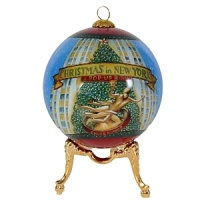 The famous Rockefeller tree and golden statue-quintessential Christmas in New York-illustrate this glass ornament from Kurt Adler.