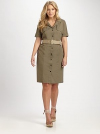 Inspired by the classic trenchcoat, this crisp, stretch cotton dress features timeless-yet-unexpected details like gunflaps.Collar neckThree-quarter sleevesGunflapsButton frontBelt includedFront pocketsRainflapPull-on styleAbout 25 from natural waist72% cotton/23% polyamide/5% Lycra®Machine washImported of Italian fabric