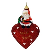 A little Santa sits atop a glittered puffed heart to wish New York a Merry Christmas.