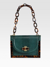 An exotic lizard embossed leather style with glossy resin accents and radiant hardware.Resin chain link shoulder strap, 10 dropMagnetic snap flap closureOne inside zip pocketOne detachable mirrorCotton lining8½W X 6¼H X 3DImported