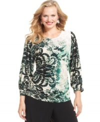 A ruched waist lends a flattering fit to Alfani's three-quarter-sleeve plus size top, featuring a vivid print.