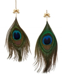 Flaunt your fashion sense with these peacock-inspired feather earrings from Betsey Johnson. Mismatched in varying sizes, they're accented with gold tone bows, crystal cup chain accents and green faux-feathers. Crafted in antiqued gold tone mixed metal. Approximate drop: 6 inches.