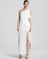 BCBGMAXAZRIA masters modern glamour with this floor-sweeping gown, boasting a one-shoulder silhouette and cascading skirt.