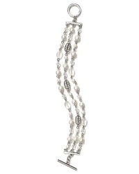 Strands of shimmering glass pearls are a graceful focal point on this three row Lauren Ralph Lauren bracelet, finished with a simple toggle closure.