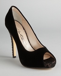 These elegant velvet peep toe pumps possess rocker edge, with rhinestone-studded heels and touches of lace; from Caparros.