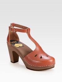 Hand-made and artfully crafted, channel '70s vibes with this leather t-strap with an adjustable ankle strap and wooden heel. Wooden heel, 3½ (90mm)Wooden platform, 1 (25mm)Compares to a 2½ heel (65mm)Leather upperWooden liningRubber soleMade in ItalyOUR FIT MODEL RECOMMENDS ordering true whole size; ½ sizes should order the next whole size up. 