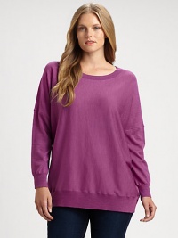 Made from merino wool and featuring classic ribbed trim, this sweater is a must-wear this season. Pair this relaxed-fit top with slim pants. Round neckLong sleevesRibbed trimPull-on styleAbout 28 from shoulder to hemMerino woolDry cleanImported of Italian fabric