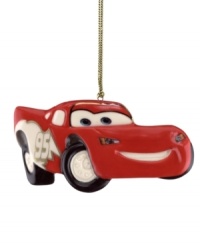 Put the pedal to the metal with your favorite Disney Pixar character Lightning McQueen. All revved up in red, this porcelain ornament from Lenox features painted gold accents and is perfect for gift-giving.