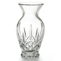 This elegant crystal creation features a sloping neck, along with intricate detailing associated with the Lismore line. Creates a classically beautiful display when accompanied by traditional roses; adds a certain sophistication when paired with fresh cut flowers.. the quintessential crystal vase.