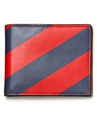 Show off your preppy side with this wide bar stripe design from Jack Spade, an excellent host for your everyday essentials in durable leather.