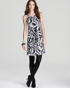 Draped in dazzling sequins and chock-full of chic, this Lilly Pulitzer dress captivates at cocktail hour with a statement abstract print. Amp up the shine factor with sleek silver accents and ignite the night.