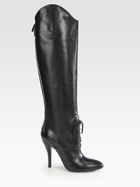 Towering high-heel boot of Italian leather, with a lace-up front and asymmetrical silhouette. Self-covered heel, 4½ (115mm)Shaft, 19Leg circumference, 13½Leather upperLace-up front with back zipBack strap with snap closureLeather lining and solePadded insoleMade in Italy